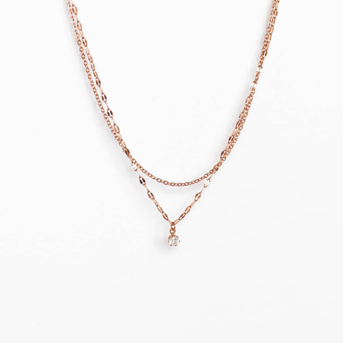 Elegant rose gold chain necklace adorned with a shimmering crystal pendant, perfect for any special occasion.