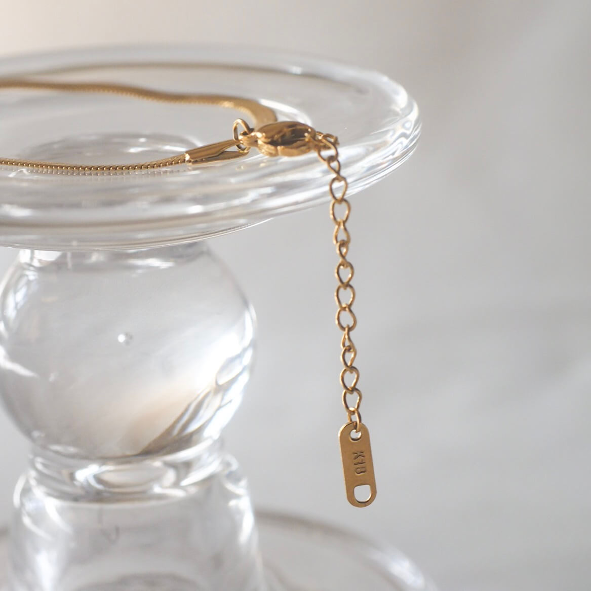 Stunning gold necklace with a sleek chain, ideal for elevating your style while keeping it classy and understated.