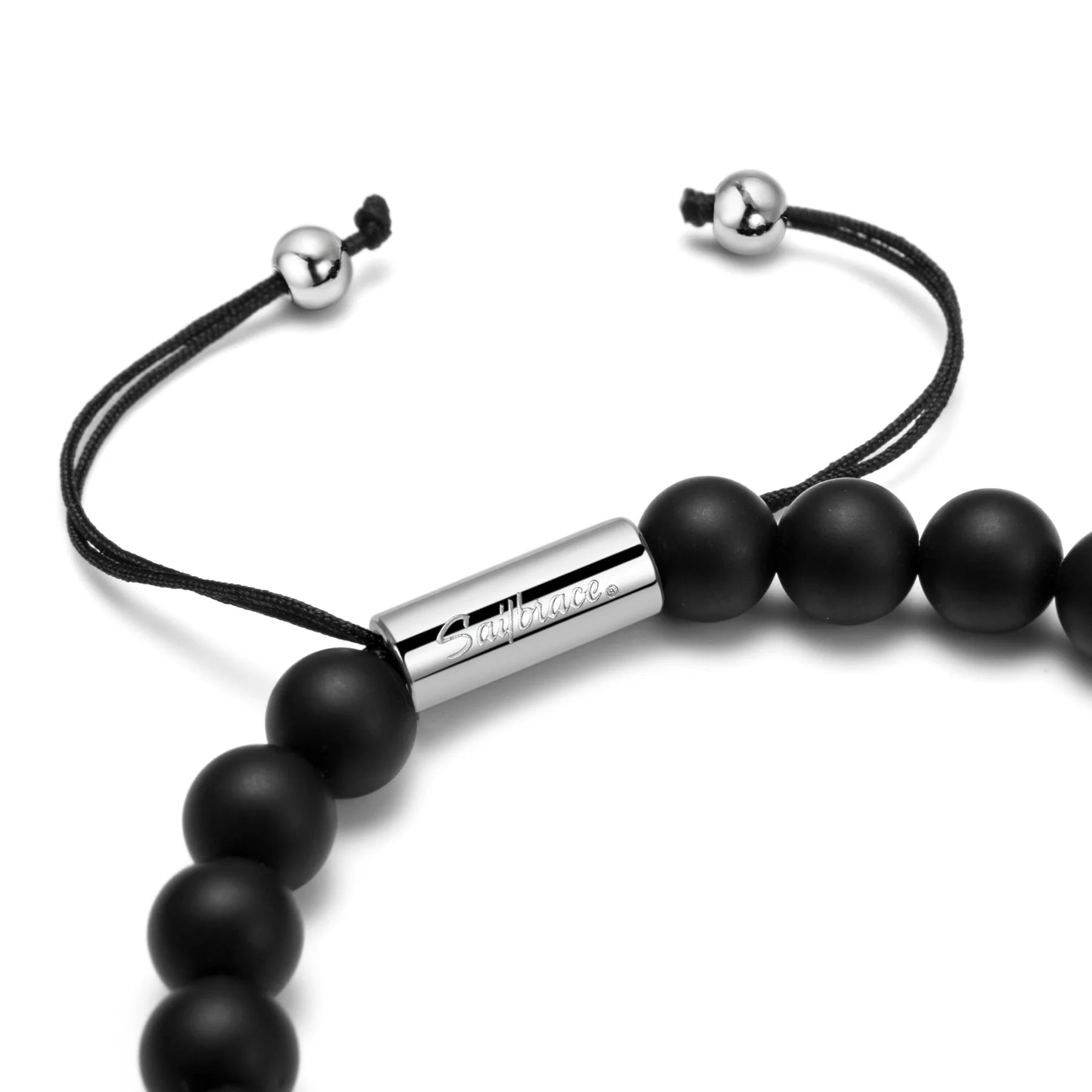 Black beaded bracelet with a silver cylindrical clasp on a white background