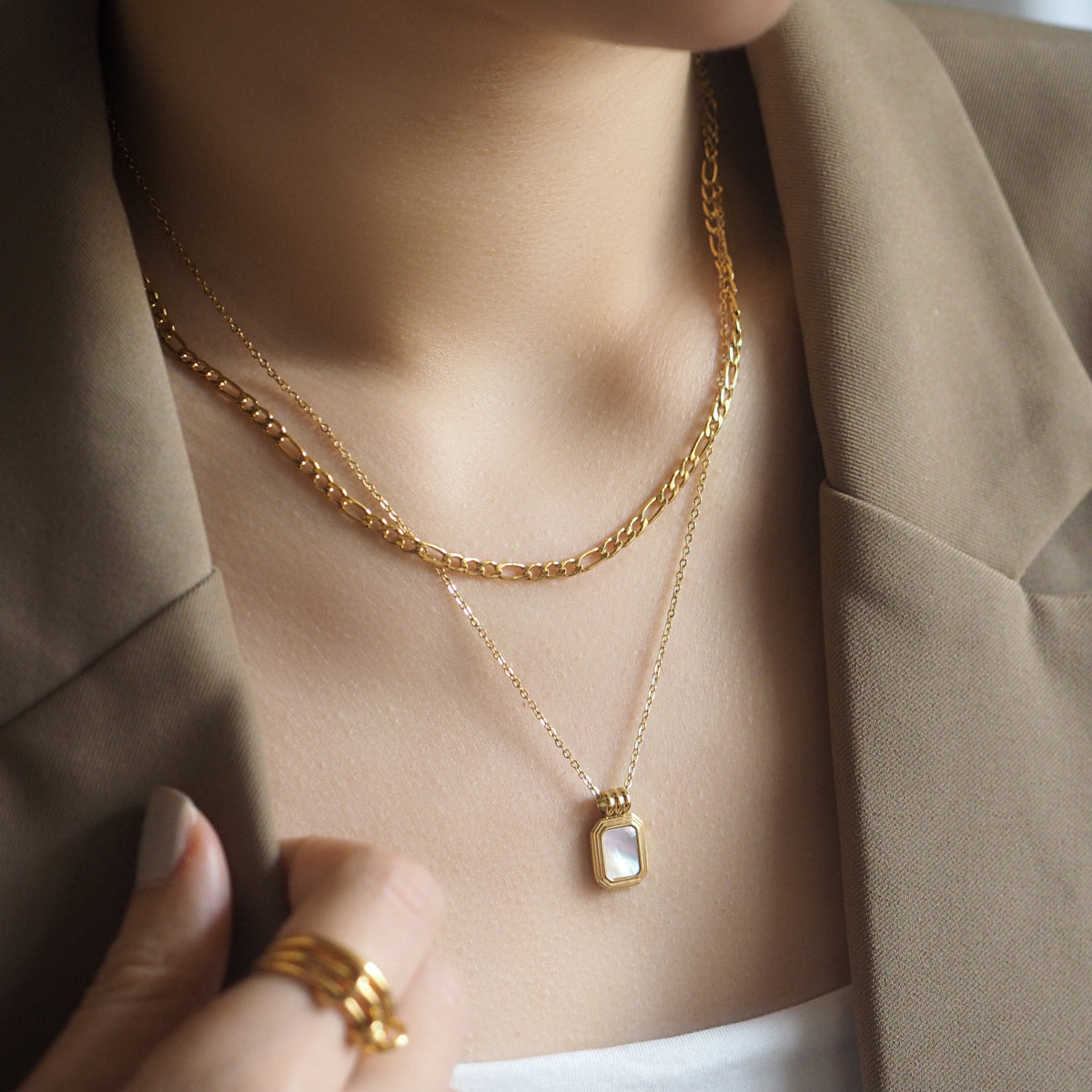 double chain necklace featuring shell pendant